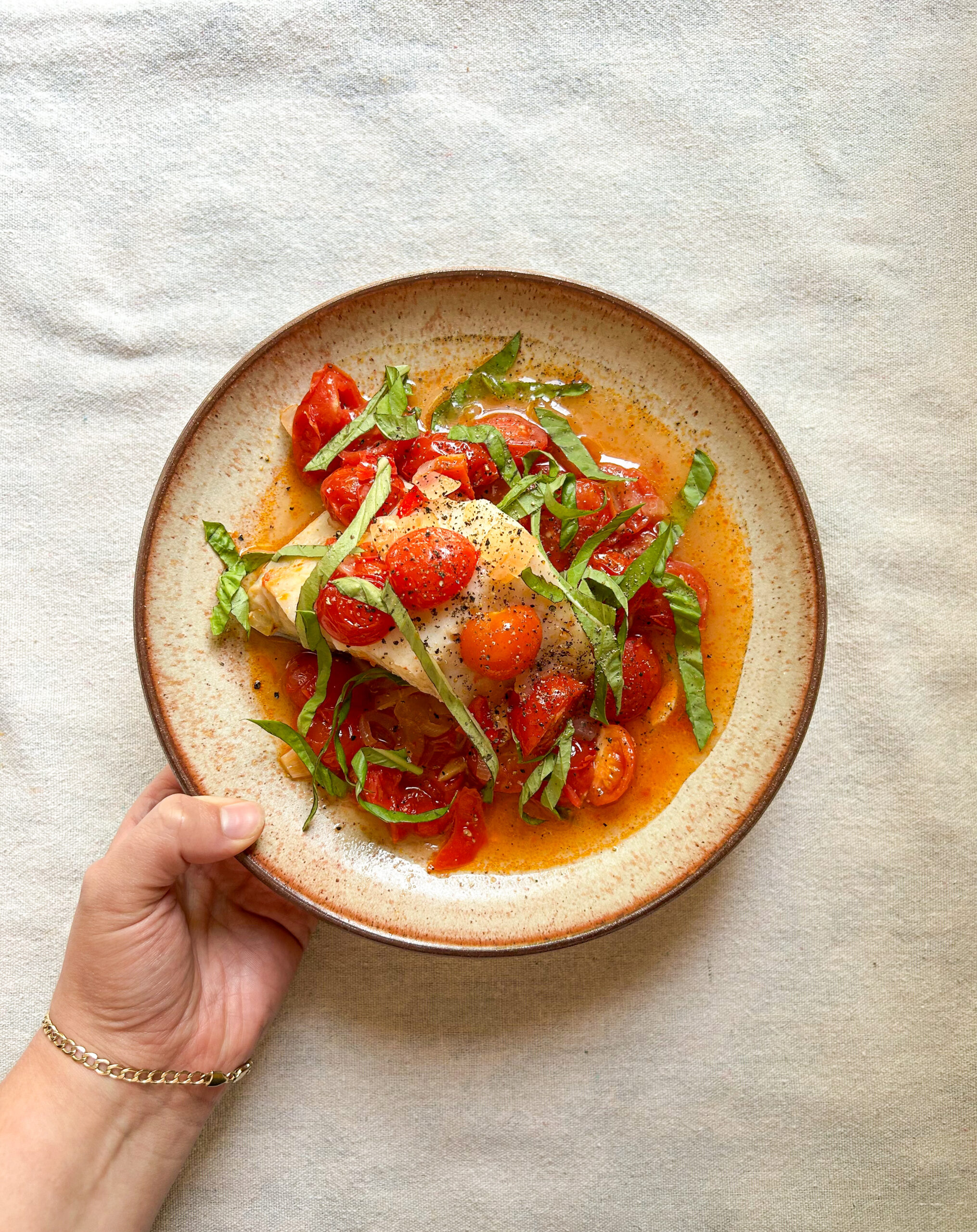 White fish poached in tomatoes, chillies and basil