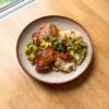 Orange-harissa chicken with citrus and olive salsa