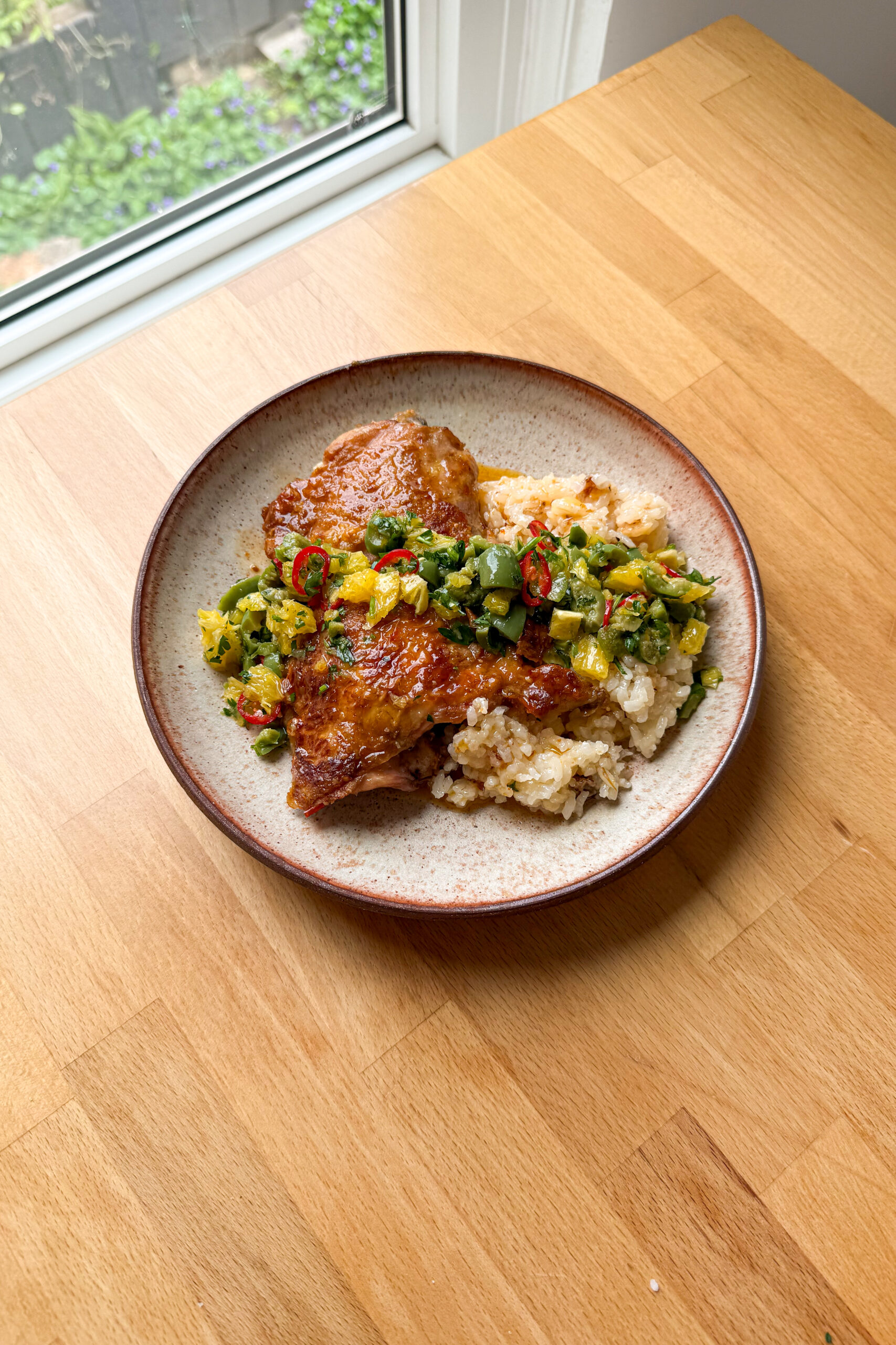 Orange-harissa chicken with citrus and olive salsa