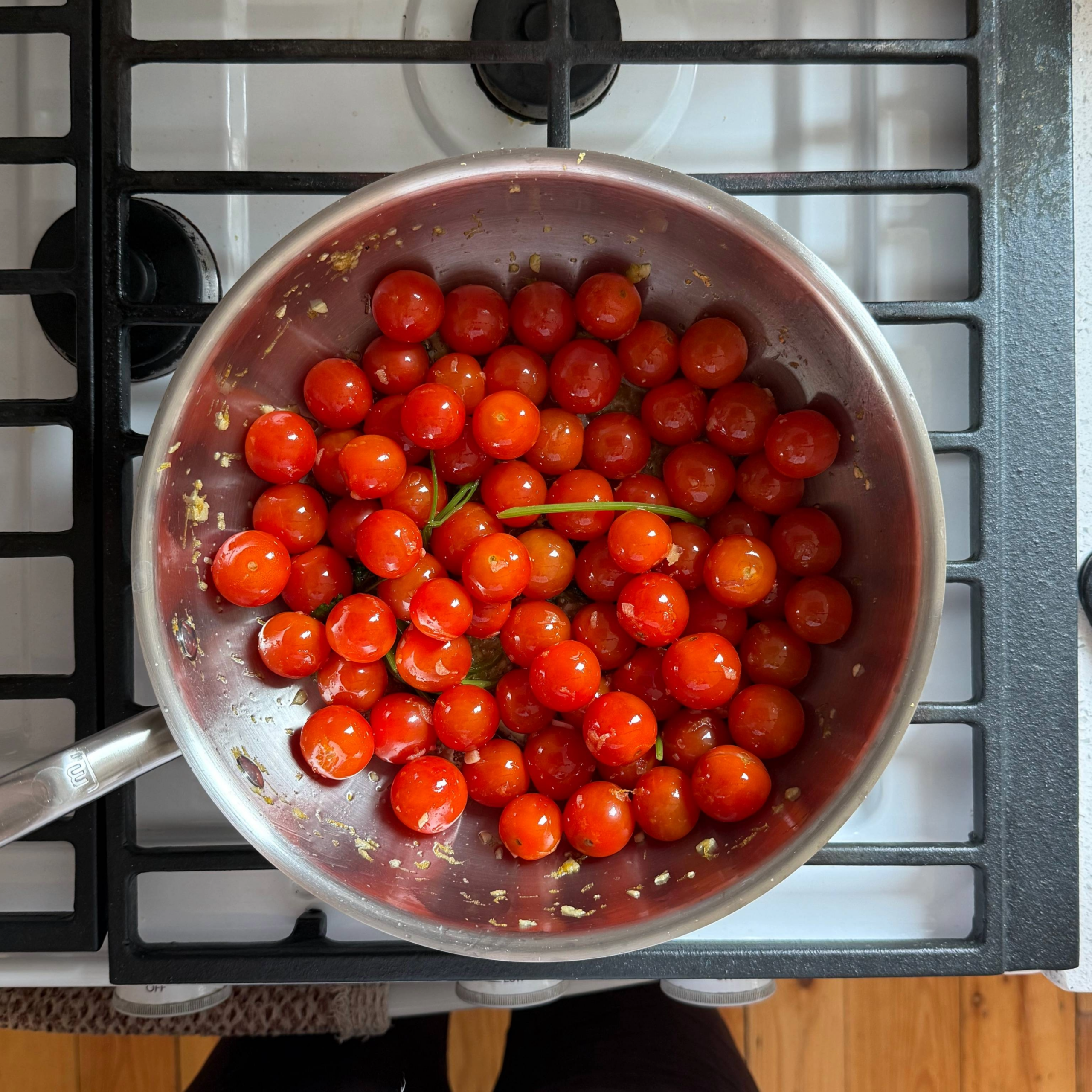 cherry tomatoes in a sauce pan