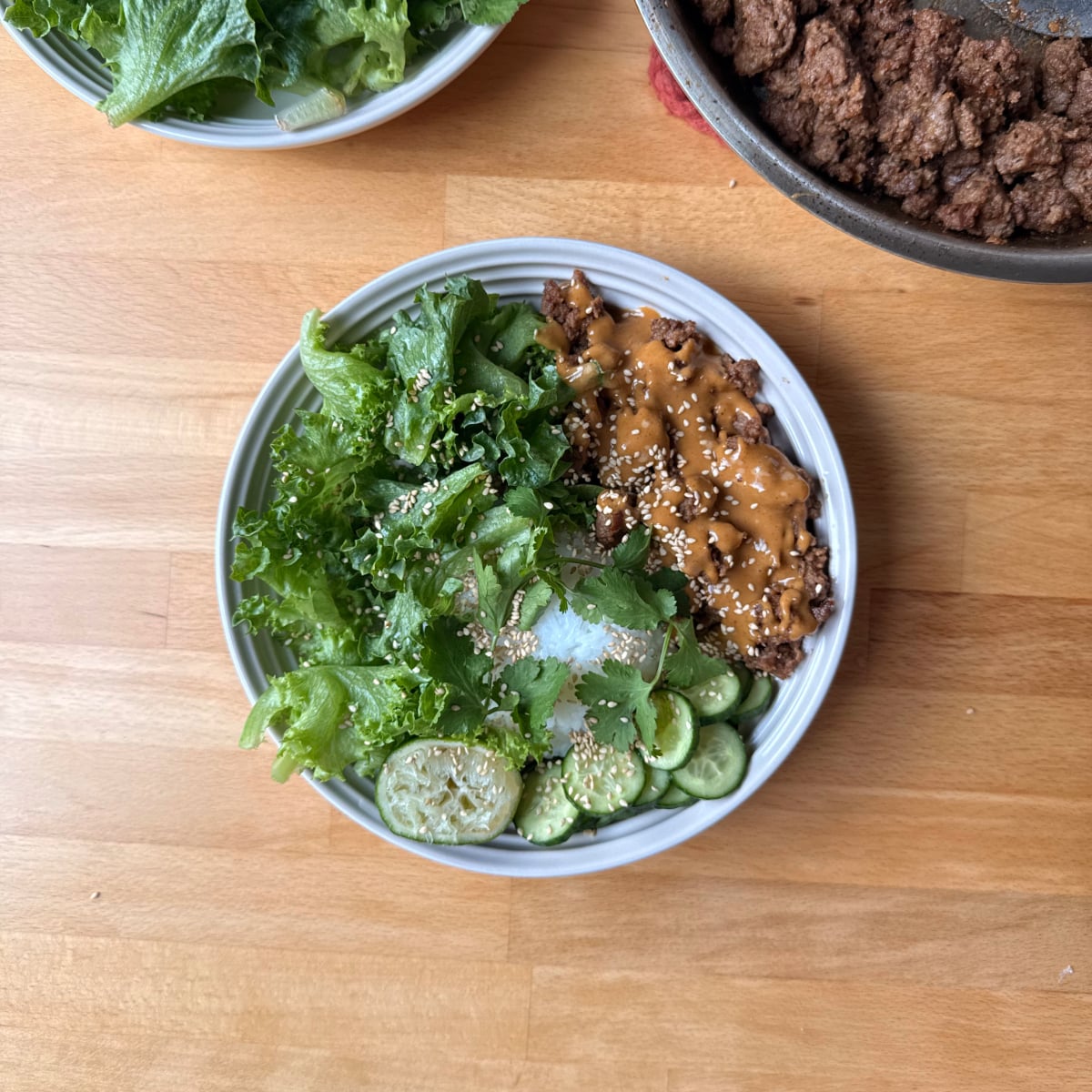 lean ground beef cooked in peanut-soy sauce served with lettuce, cucumber, cilantro and lime